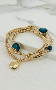 Envy - Gold 3-Strand Bracelet with Radom Gold & Blue Stone Charms