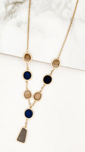 Short gold necklace with blue and taupe resin circles